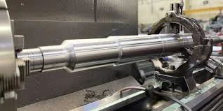 Heavy shaft mounted on a lathe for machining